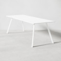 Konferensbord med vit laminatskiva och vitt metallunderrede med två utställda benpar. 90 centimeter högt.